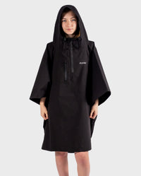 Girl wearing Black Kids dryrobe® Waterproof Poncho with hood up 