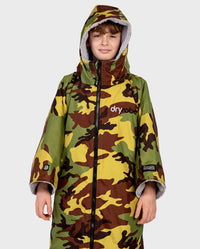 Boy wearing dryrobe Advance Short Sleeve changing robe in Camo Grey with hood up 