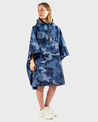 Girl wearing Blue Camo Kids dryrobe® Waterproof Poncho 