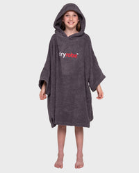 Girl smiling wearing Kids Towel Robe in Slate Grey with hood up 