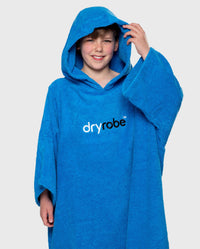 Boy wearing Cobalt Blue Kids Organic Towel robe with hood up