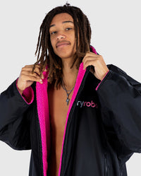 Close up of *MALE* wearing Black Pink dryrobe® Advance Long Sleeve