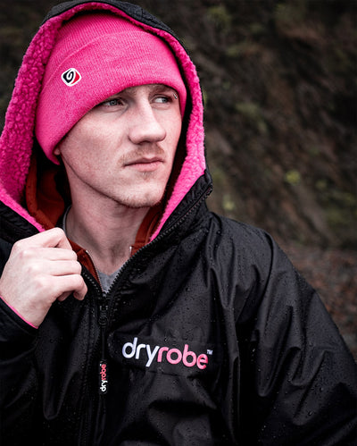 Close up of *MALE* wearing Pink dryrobe¬Æ Eco Beanie and Black Pink dryrobe¬Æ Advance Long Sleeve