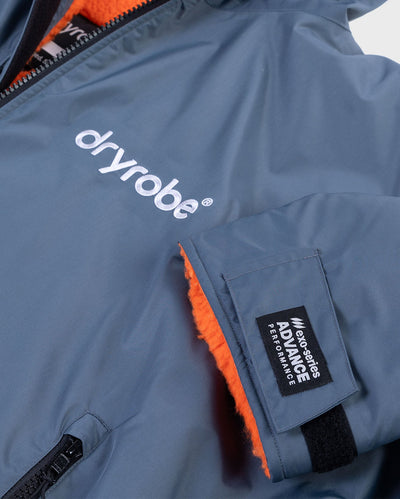**MALE** Close up of end of sleeve on dryrobe Advance Long Sleeve change robe in Dark Grey Orange