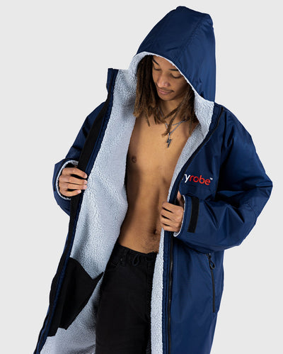 *MALE* wearing Navy Grey dryrobe® Advance Long Sleeve, unzipped showing the lining