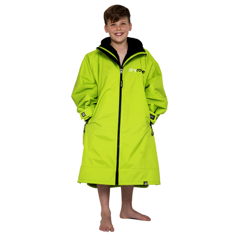 Boy wearing kids dryrobe® Advance change robe in lime green and black