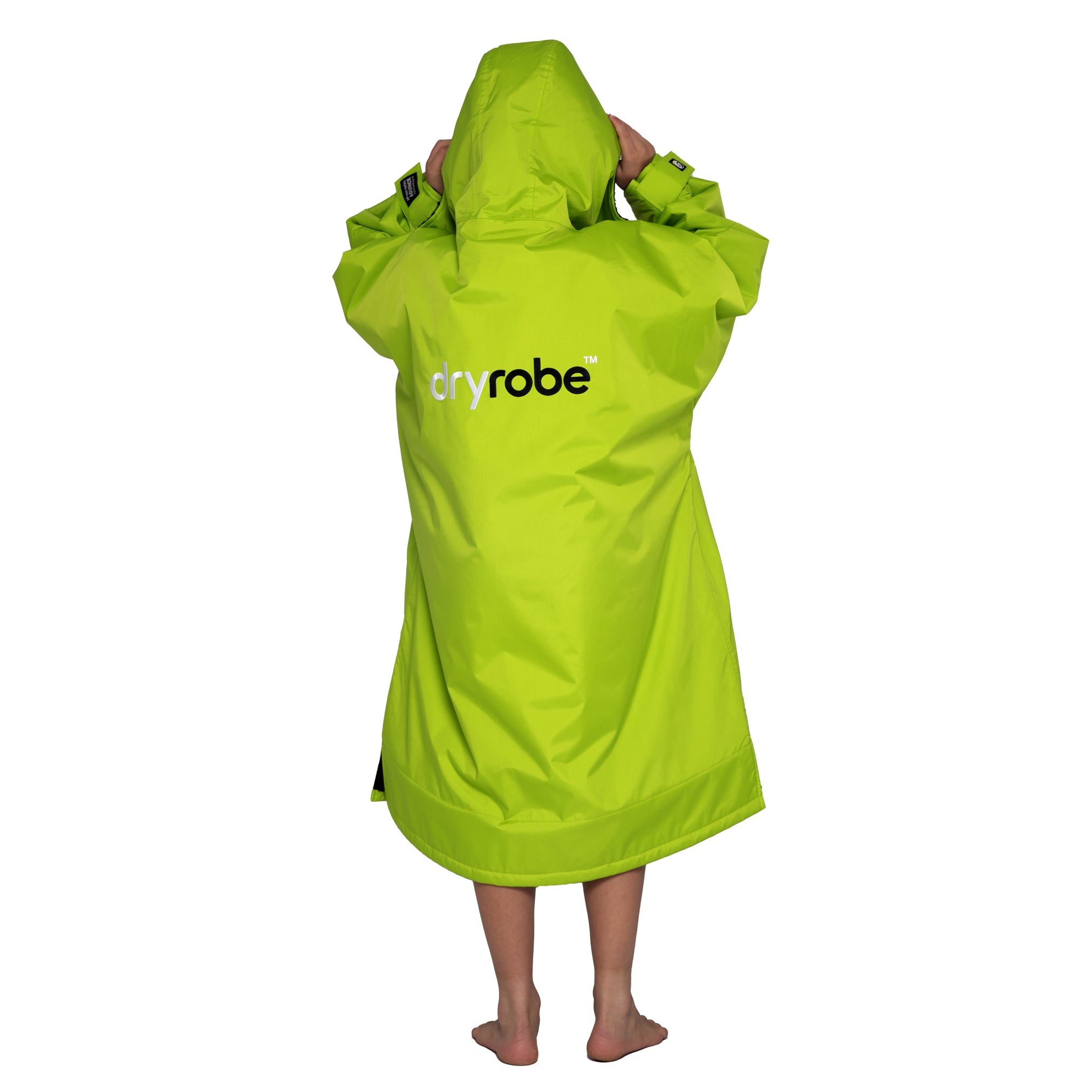 Boy wearing kids dryrobe® Advance change robe in lime green and black showing back view